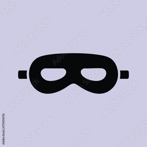 Black mask with eye holes and elastic strap designed for disguise or costume accessory in dark color
