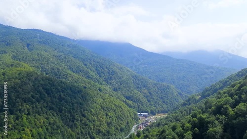 A cable car ride high up in the mountains with beautiful summer scenery.