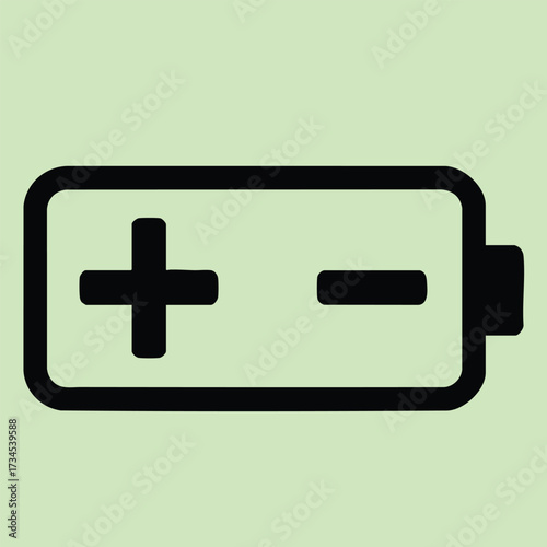 Close-up of a battery with plus and minus symbols on a light green , representing energy, power, or electronic devices