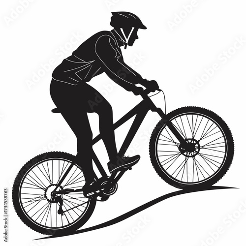 Silhouette of a mountain biker riding on a trail