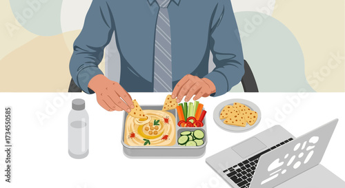 Office worker enjoying a healthy lunch break with hummus, vegetables, and pita chips at desk