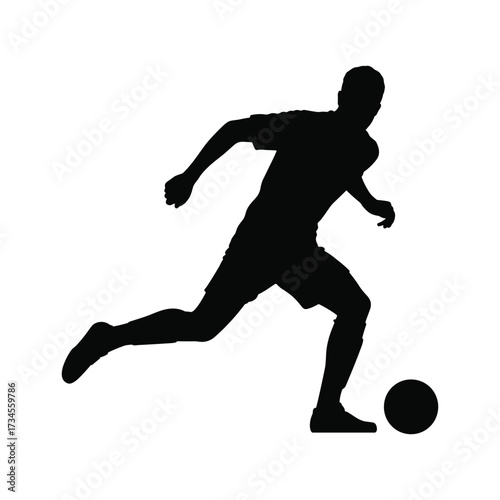 Dynamic silhouette of a soccer player kicking ball in action sports photography