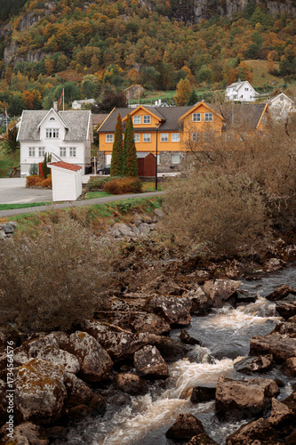 Colorful Houses by Rocky River in Autumn. Norway city