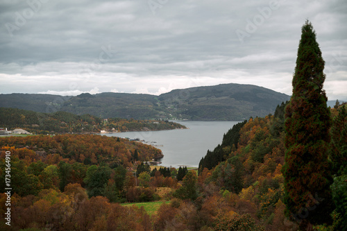 Autumn Lake and Hills Under Cloudy Sky. Norway fjord