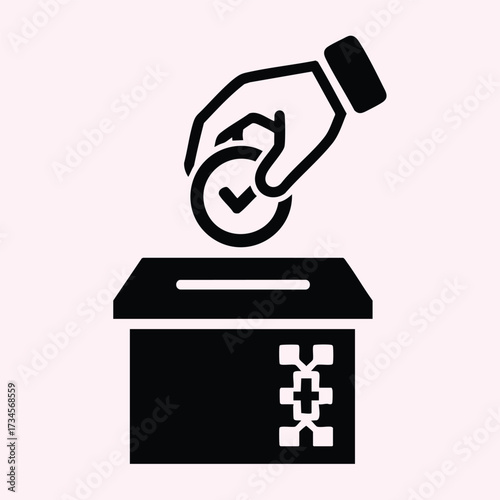 Hand placing a coin into a donation box symbolizing charity, giving, and financial contribution for social causes