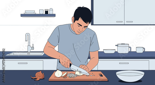 Man preparing food in the kitchen, chopping onions on a wooden board with a knife in a clean