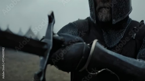 A Knight readying his sword, ready for battle in historical times. The image captures the intensity and preparation before a conflict