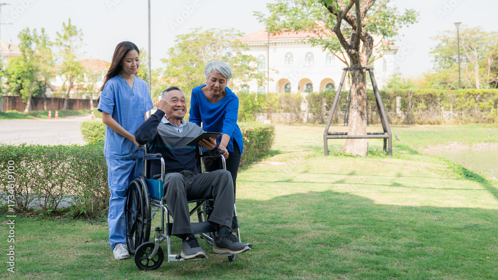 Fototapeta premium Senior man in wheelchair enjoying outdoor time with family and caregiver nurse, symbolizing elderly care, support, healthcare, nursing service, and happy retirement life.