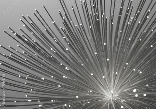 Abstract monochromatic starburst of radiating metallic rods with glowing tips against a grey background.