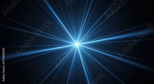 Brilliant blue starburst light effect with radial rays bursting outward against dark sky