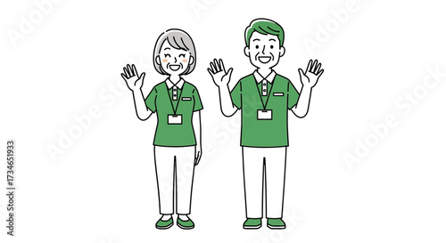 Two cheerful senior caregivers, a man and a woman in green scrubs, waving hello and embodying dedicated and friendly elder care services with professionalism