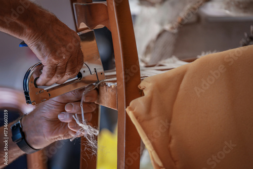 upholsterer craftsman working in the workshop