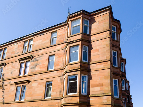 Glasgow's tenements, traditional stone apartment buildings, 2-5 stories tall, that housed the city's industrial population in the 19th century. Built in blocks along streets, city's grid pattern.