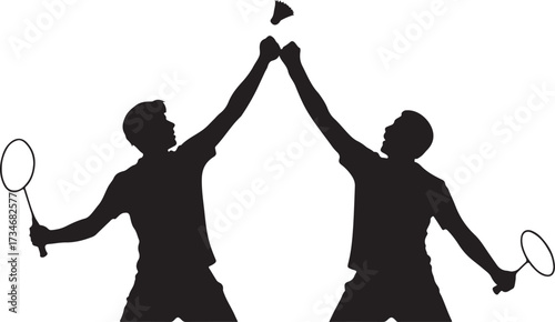 Two male badminton players in silhouette celebrating victory with shuttlecock in the air sport