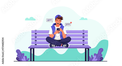 Happy young man sitting on a park bench using his mobile phone and receiving messages
