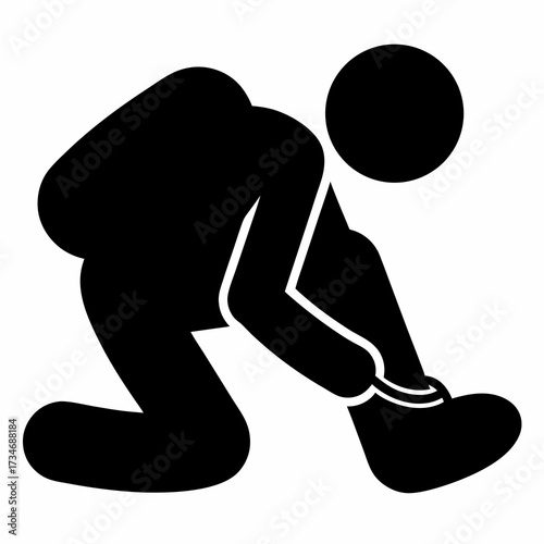 Person bending over to fasten or untie shoelaces in black silhouette