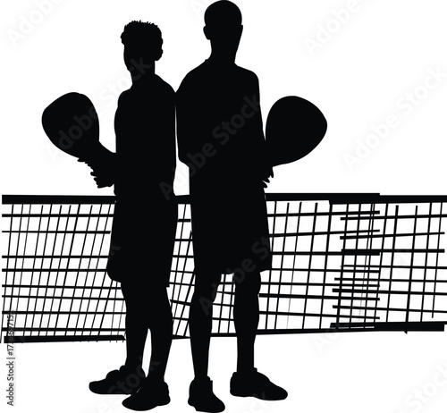 Silhouette of two male pickleball players standing back to back by the net two men