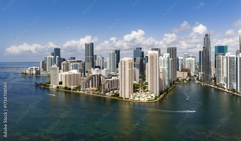 Fototapeta premium Aerial view of Brickell skyscrapers. Modern cityscape of downtown Miami. Panoramic Miami skyline above the coastline. Brickell Key aerial view in Miami.