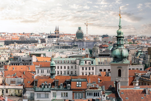 Photography Green copper dome is rising above the red roofs of Prague in a sunny summer day
