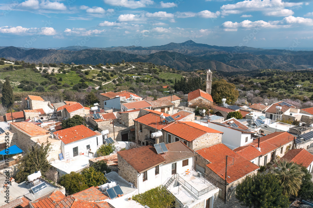 Obraz premium Kato Lefkara village houses with mountains and church bell tower. Cyprus
