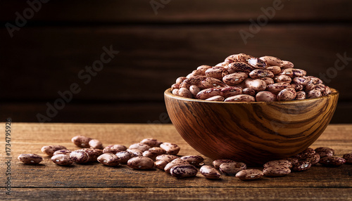Wooden Bowl Full Of Pinto Beans On A Wooden Table