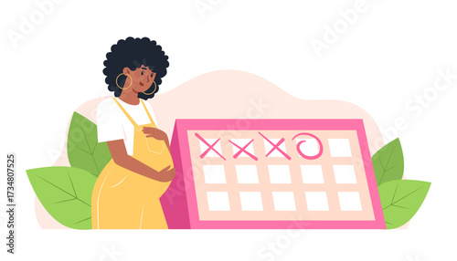 Pregnant woman looking at a calendar with marked days