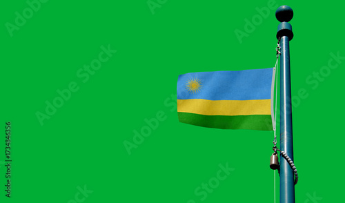 Obraz na plátne Rwanda flag silhouetted against a warm sunset sky creating an emotive scene