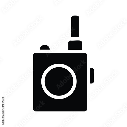 Close-up of a compact walkie-talkie radio device with antenna and control buttons on a plain