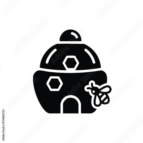 Simplified black and white of a traditional beehive with a small bee flying nearby, representing nature and pollination concepts