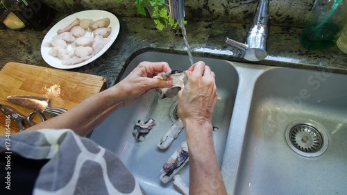 Housewife cooking fish stew at home. High quality 4k footage