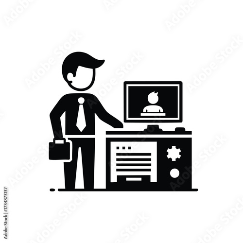 Business professional standing next to a desk with a computer monitor displaying a person silhouette, symbolizing remote work or virtual communication