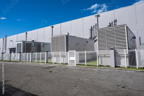 Standby diesel generators outside warehouse building