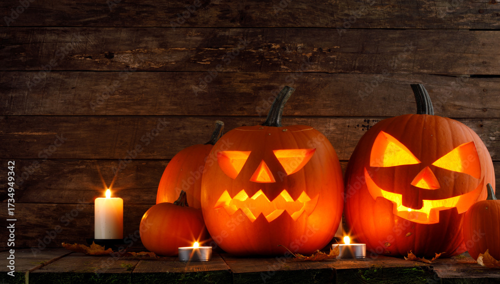 Fototapeta premium halloween pumpkins on wooden background