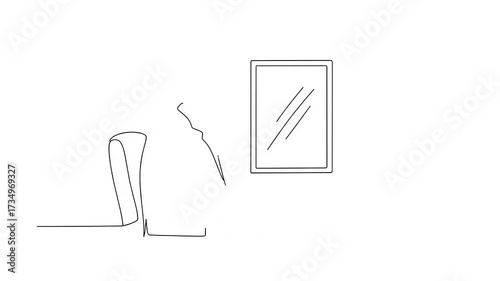 Man Working on Laptop at Desk with Mirror.