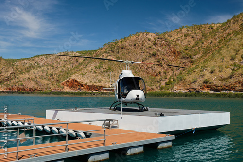 Small helicopter on the helipad waiting for tourists - Talbot Bay, WA, Australia