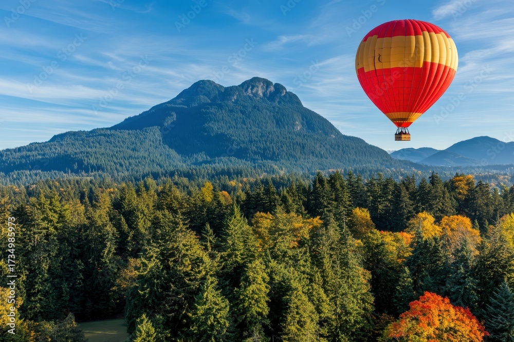 Fototapeta premium Colorful Hot Air Balloon Over Scenic Mountain Landscape