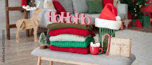 Stack of winter clothes wit...