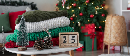 Stack of winter clothes wit...