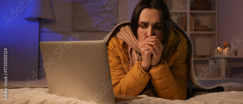 Frozen young woman with lap...
