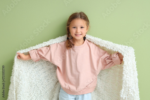 Cute little girl with warm ...