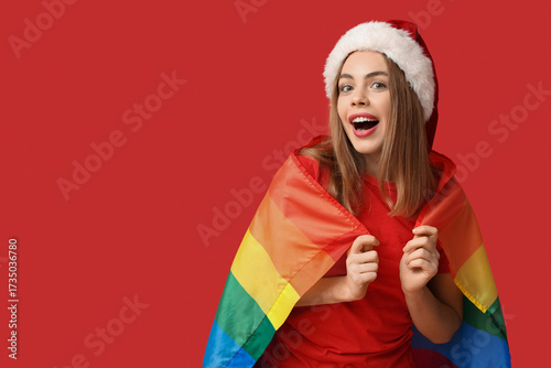 Young woman in Santa hat wi...