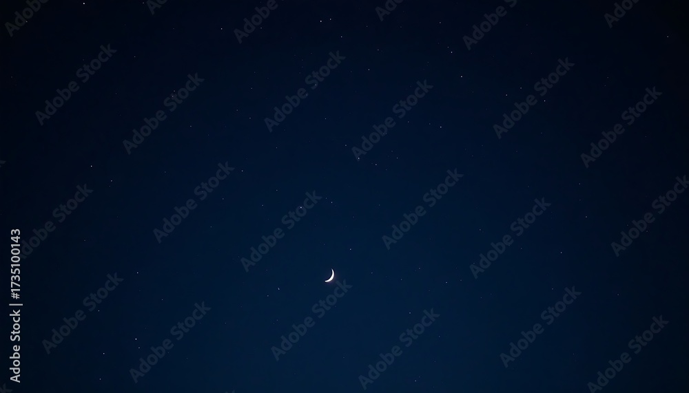 Fototapeta premium Crescent Moon and Scattered Stars Illuminating a Deep Night Sky