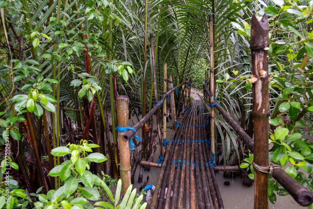 Obraz premium bamboo bridge on a canal