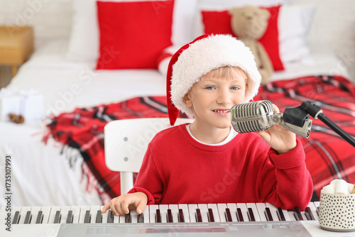 Cute little boy in Santa ha...