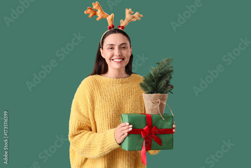 Smiling young woman in rein...