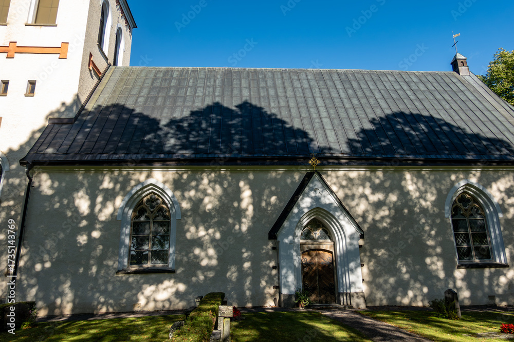 Fototapeta premium Tärna, Sweden The facade of the Tärna Kyrka or Tärna Church on a sunny day.