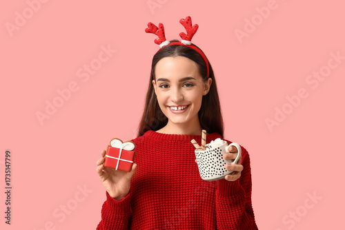 Young woman with tasty Chri...