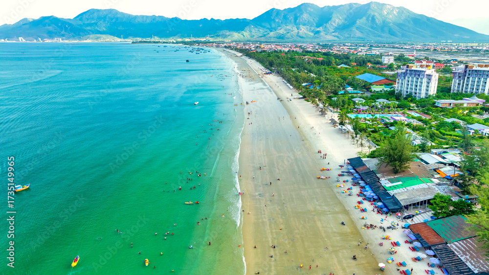 Fototapeta premium Aerial view of tropical Doc Let beach with turquoise waters and white sand in Vietnam
