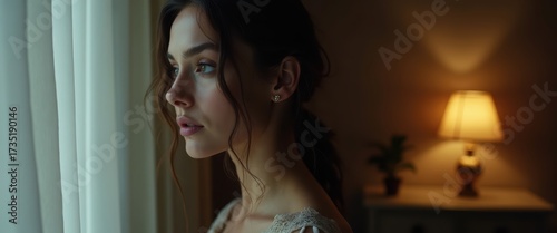 Quiet Luxury Fashion Portrait, Young Woman in Soft Light Looking Thoughtfully Out the Window