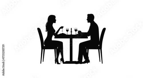 Couple enjoying a romantic dinner together at a table silhouette